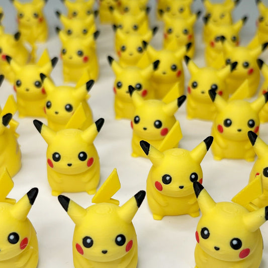 a group of pikachu figurines sitting on top of a table