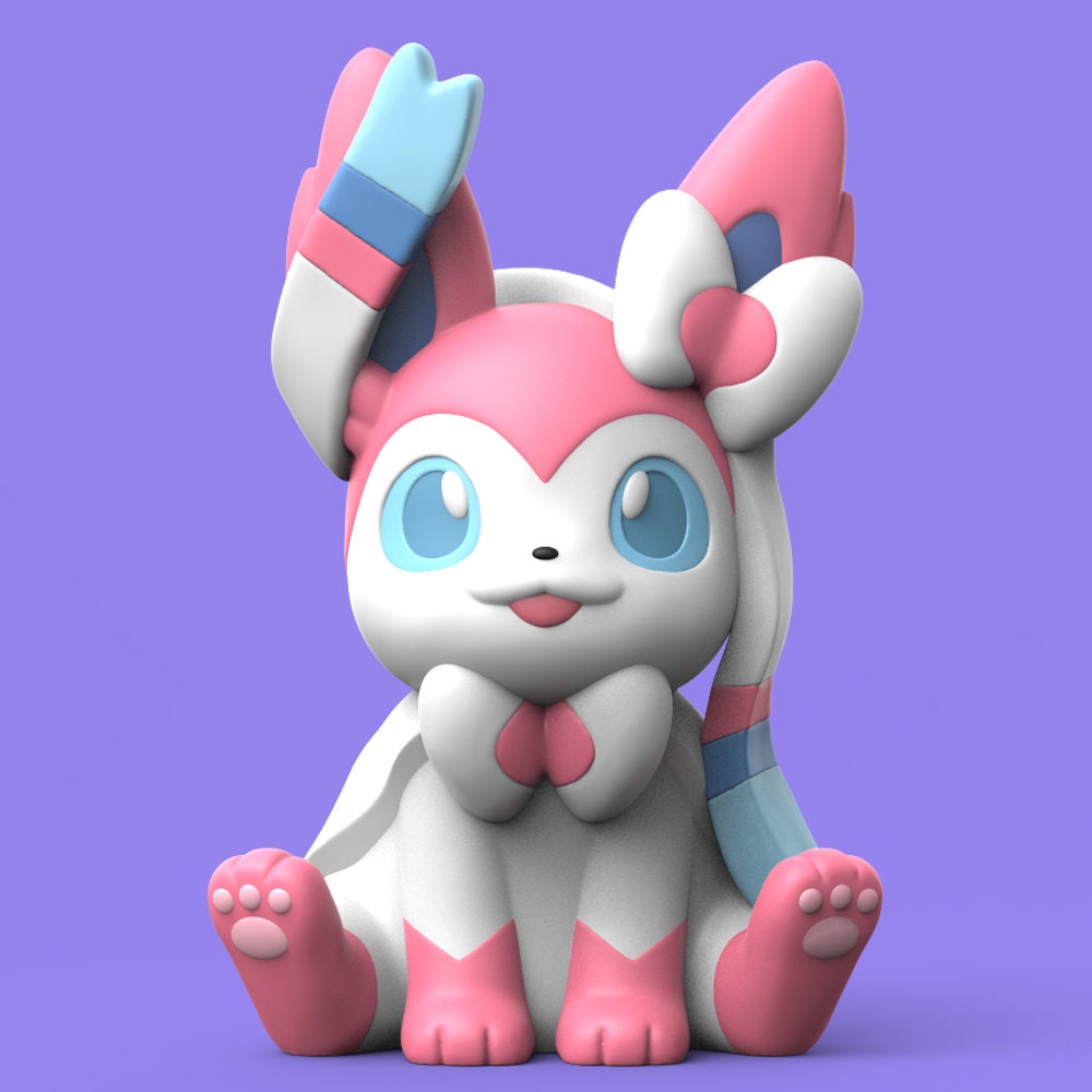 a pink and white toy sitting on top of a purple surface