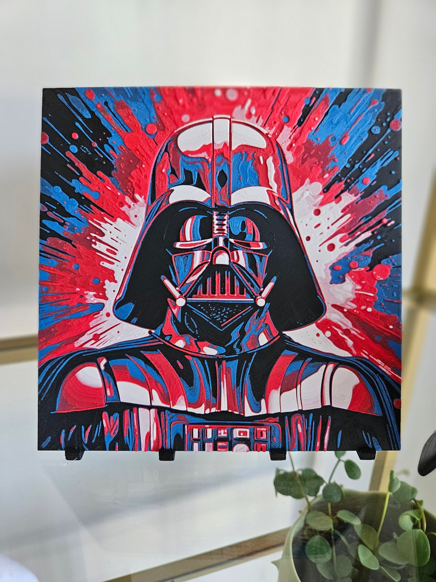 a picture of a darth vader poster hanging on a wall